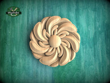 Load image into Gallery viewer, A wooden flower-shaped carving is displayed against a green background.