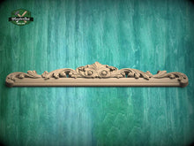 Load image into Gallery viewer, a decorative wooden molding with an ornate design, set against a textured green background.