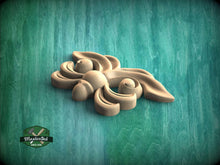 Load image into Gallery viewer, A wooden carving of a butterfly or dragon-like creature is displayed against a green background.