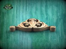 Load image into Gallery viewer, A wooden carving of a stylized face is displayed against a teal-colored background.