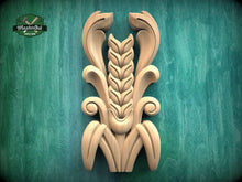Load image into Gallery viewer, a carved wooden design with a stylized wheat stalk and leaves, set against a green background.