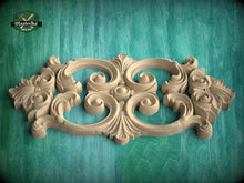 Load image into Gallery viewer, a beautifully carved wooden piece with intricate designs, displayed against a green background.