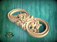 Load image into Gallery viewer, A wooden carving of a flower and leaf design, featuring intricate details and a circular shape, is displayed against a green background.