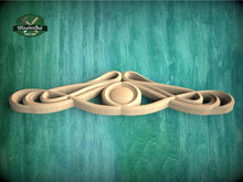 Load image into Gallery viewer, a group of wooden objects sitting on top of a green surface