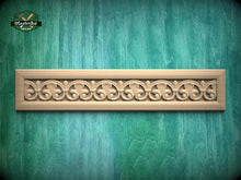 Load image into Gallery viewer, A decorative wooden panel with an intricate floral design is displayed against a green textured background.