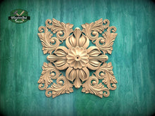 Load image into Gallery viewer, a decorative golden floral pattern on a green background.