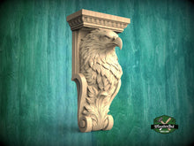 Load image into Gallery viewer, A carved wooden eagle head mounted on a wall, with a decorative scroll design below it.