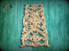 Load image into Gallery viewer, an ornate, carved wooden panel with intricate floral and scroll designs, set against a green background.