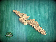 Load image into Gallery viewer, a wooden carving of a dragon on a green background