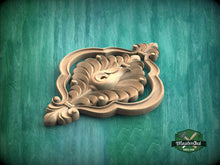 Load image into Gallery viewer, A decorative wooden carving with an ornate, floral-like design is displayed against a green background.