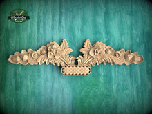 Load image into Gallery viewer, a wooden carving of a vase with flowers