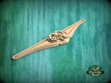 Load image into Gallery viewer, A wooden carving or sculpture is displayed against a green background.