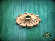 Load image into Gallery viewer, A wooden flower-shaped object is displayed against a green background.