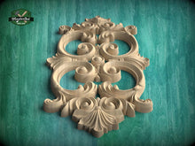Load image into Gallery viewer, a beautifully carved wooden piece with intricate designs, displayed against a green background.