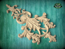Load image into Gallery viewer, an ornate, carved wooden piece with intricate, decorative patterns and designs.