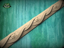 Load image into Gallery viewer, a decorative wooden border with intricate floral designs, set against a green wooden background.