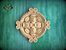 Load image into Gallery viewer, a decorative wooden panel with an intricate floral design, set against a green background.