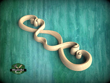 Load image into Gallery viewer, A wooden carving resembling a heart shape is displayed against a teal background.