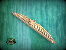 Load image into Gallery viewer, A wooden carving or sculpture is displayed against a green background.