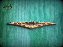 Load image into Gallery viewer, A decorative wooden panel with intricate floral designs is displayed against a textured green background.