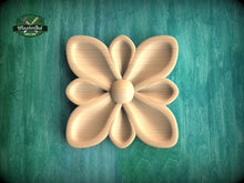 Load image into Gallery viewer, A wooden flower-shaped object is displayed against a green background.