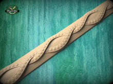 Load image into Gallery viewer, A decorative wooden molding with a swirling pattern is displayed against a green wooden background.