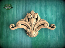 Load image into Gallery viewer, A decorative wooden carving with an intricate, ornate design is displayed against a green background.