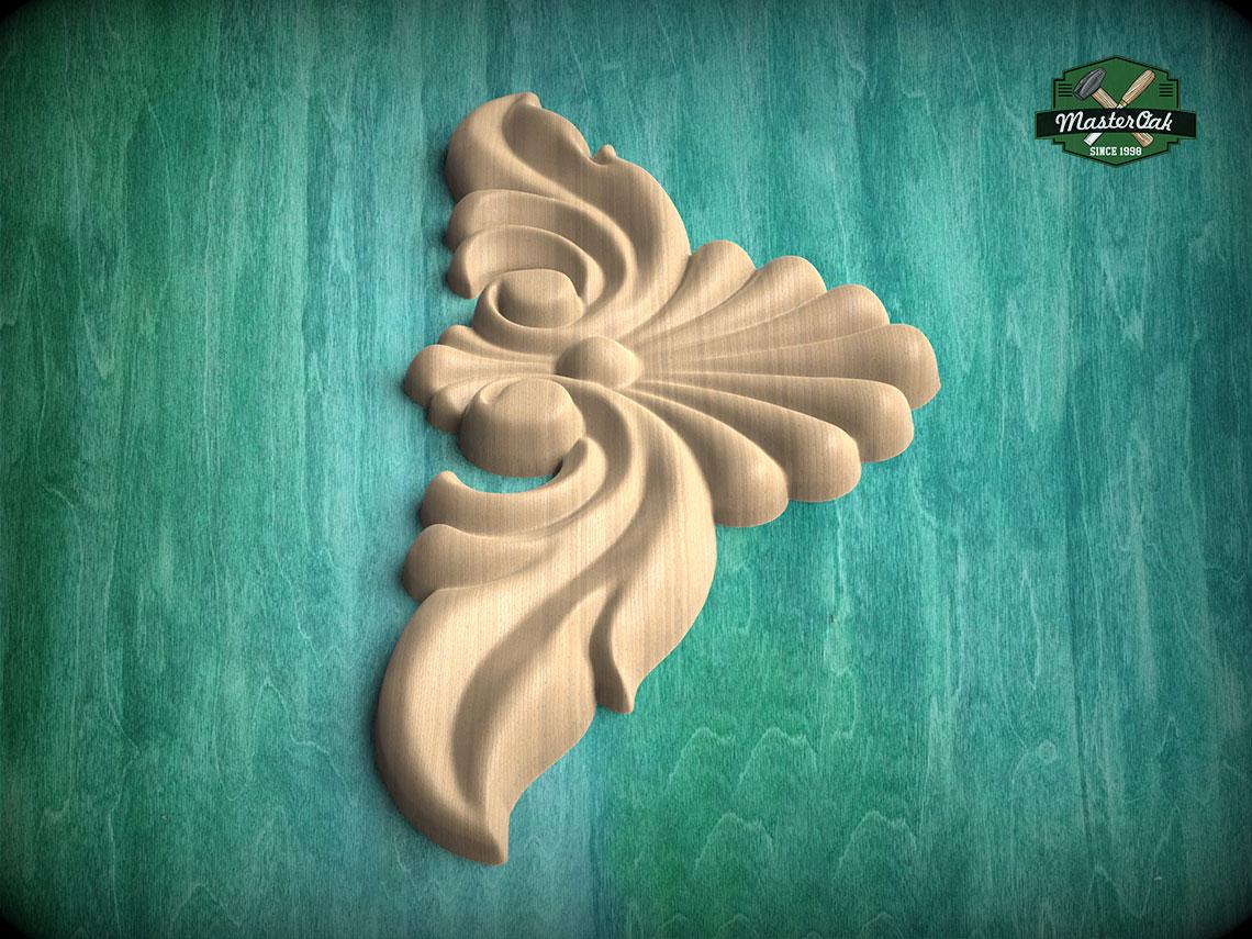 A decorative wooden carving in the shape of a flower or leaf is displayed against a green background.