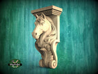 A carved wooden horse head mounted on a wall, with a green background.