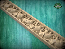 Load image into Gallery viewer, A carved wooden panel with a repeating pattern of elephant figures, set against a green textured background.
