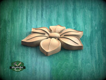 Load image into Gallery viewer, A wooden flower carving is displayed against a green background.
