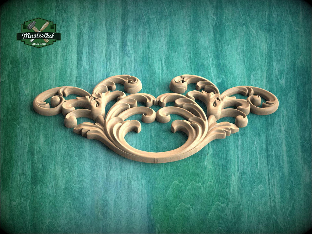 A decorative wooden carving with intricate scrollwork is displayed against a green wooden background.