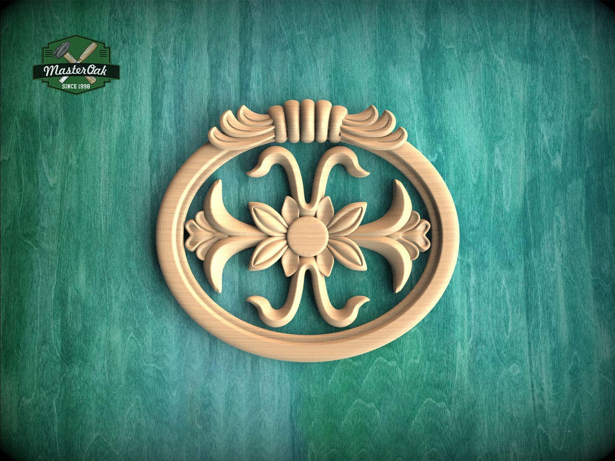 A wooden ornamental piece with a floral design is displayed against a green background.