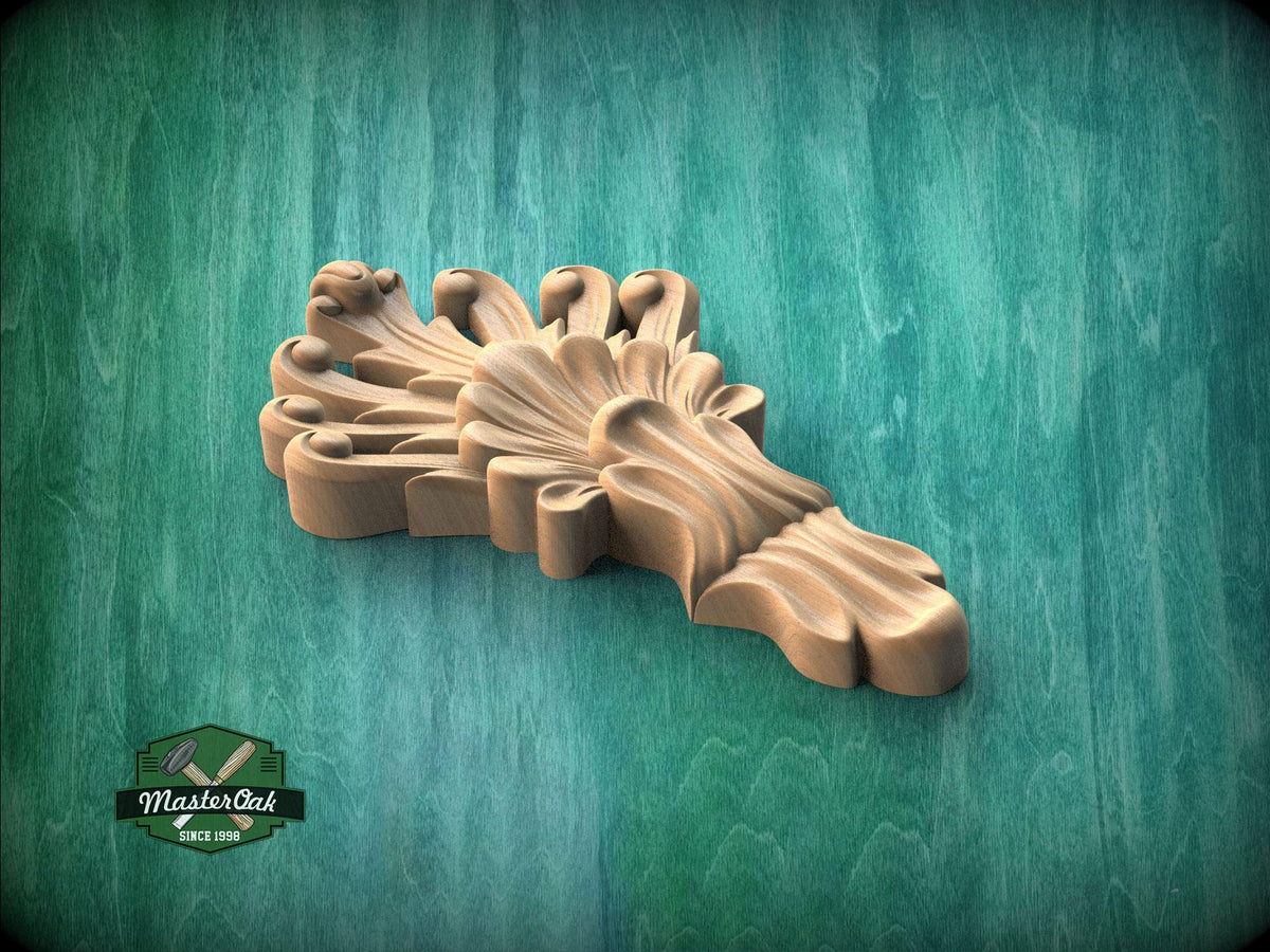 A wooden carving of a stylized flower or plant with intricate details is displayed against a green background.