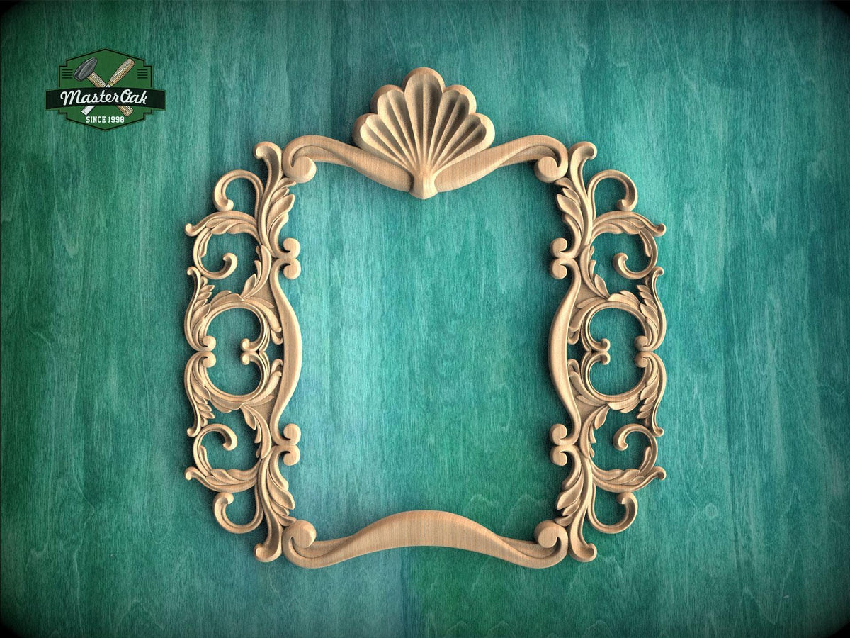 an ornate, carved wooden frame with intricate scrollwork and a shell-like design at the top, set against a teal background.