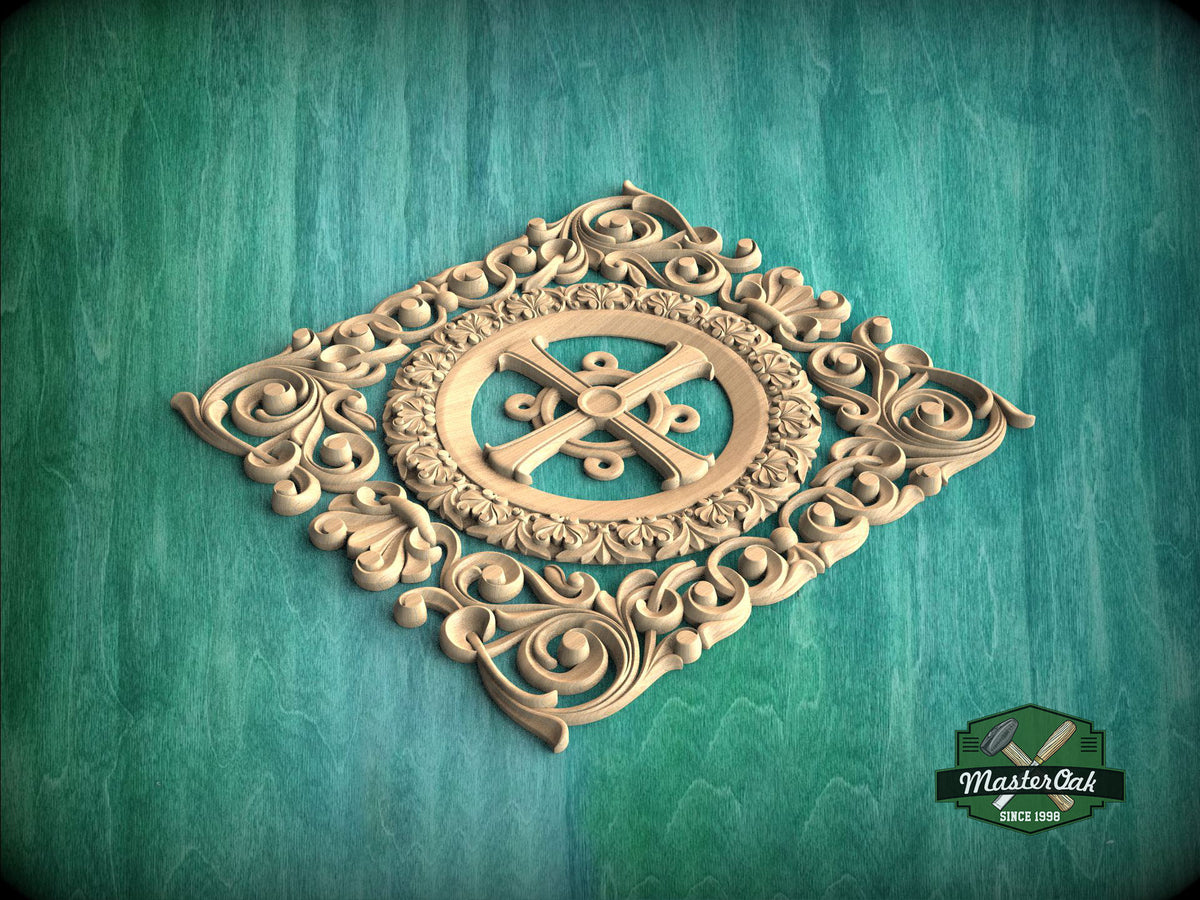 a decorative wooden carving with intricate scrollwork and a central motif, set against a green background.