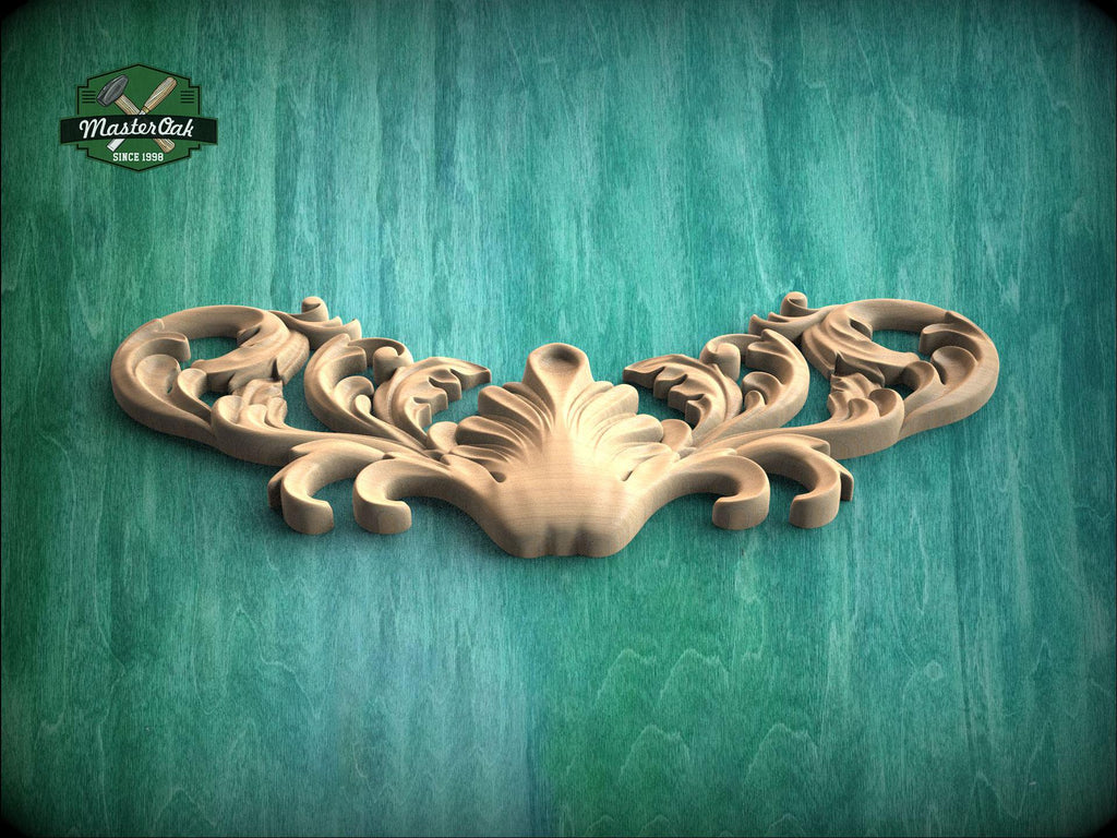 A decorative wooden carving with intricate scrollwork is displayed against a green wooden background.