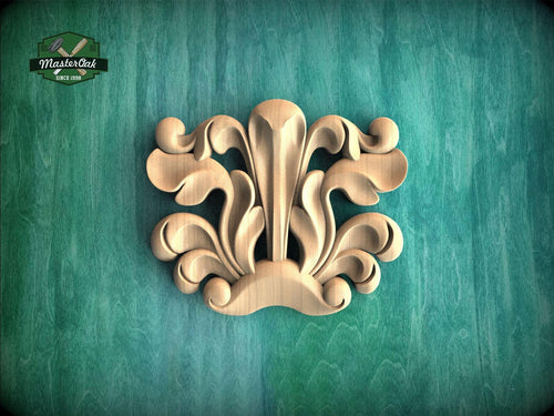 a decorative wooden carving on a green background.