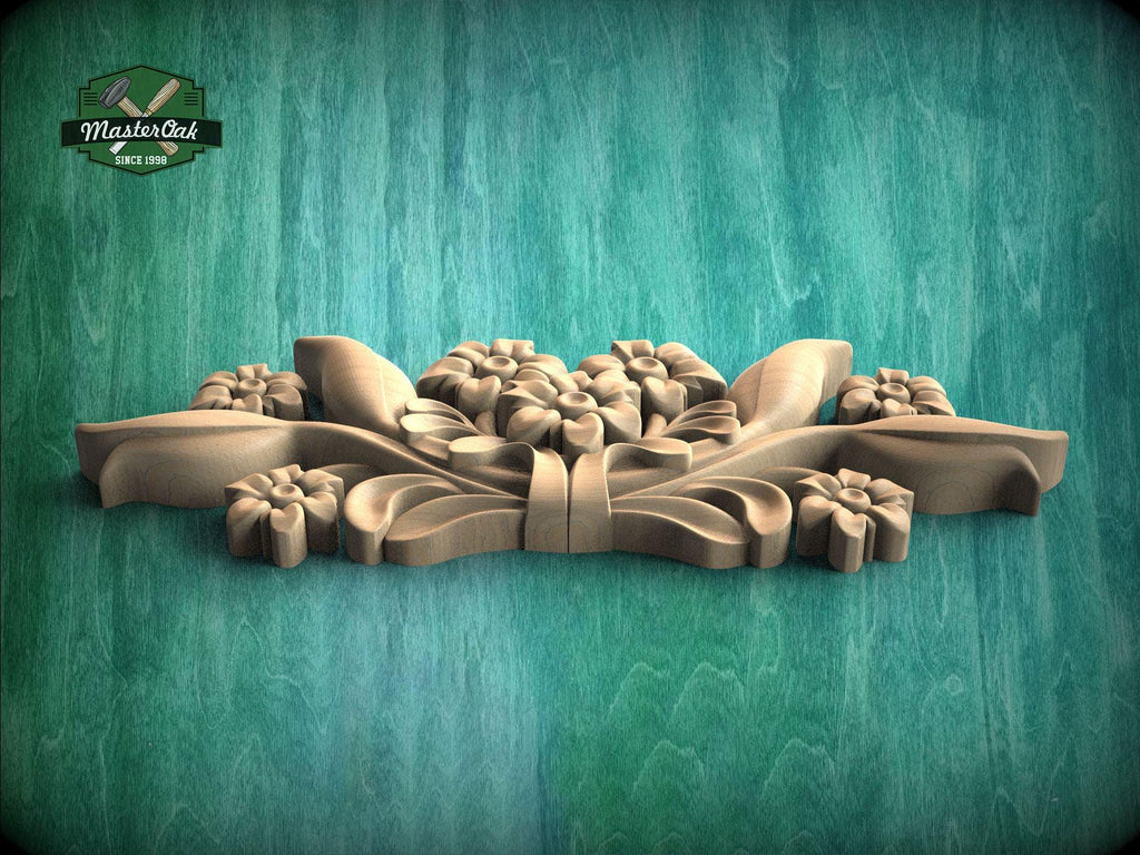 A wooden carving of a floral design is displayed against a green background.