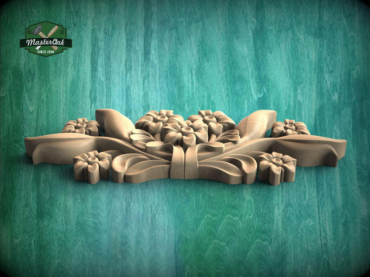 A wooden carving of a floral design is displayed against a green background.