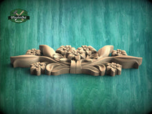 Load image into Gallery viewer, A wooden carving of a floral design is displayed against a green background.
