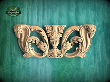 Load image into Gallery viewer, an ornate carved wooden piece with intricate floral designs, displayed against a green background.
