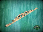 a wooden toothbrush holder is shown on a green background