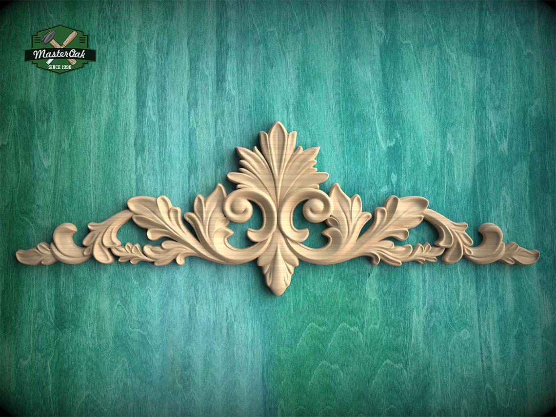 a decorative wooden carving on a green background.