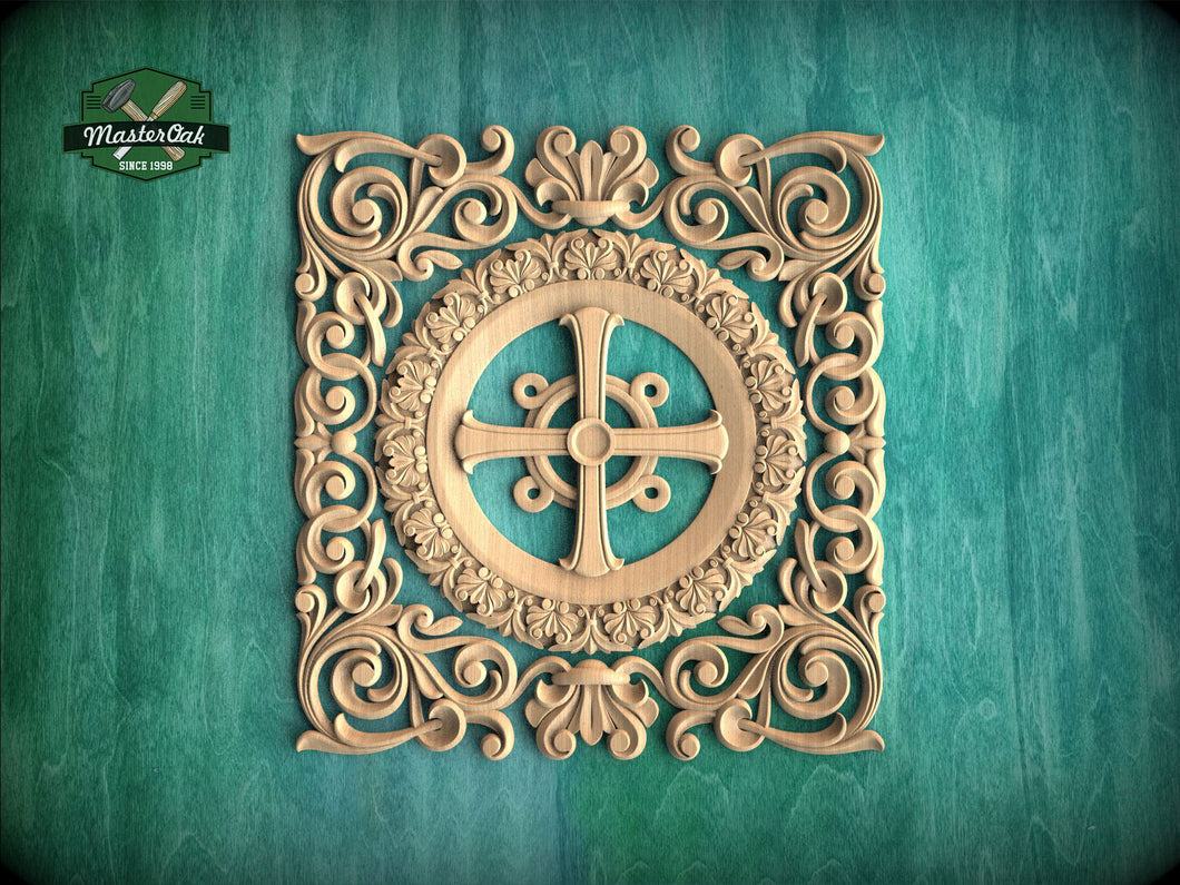 a square, ornately carved wooden cross with intricate floral designs surrounding it, set against a teal background.
