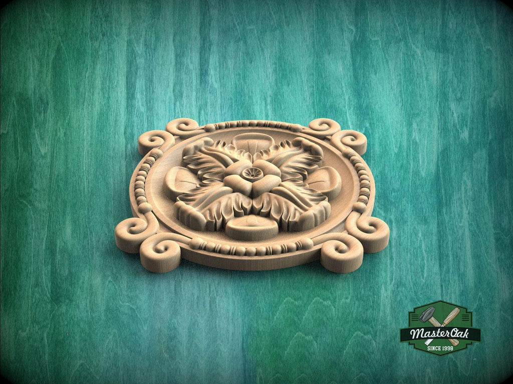 A wooden carving of a flower with leaves, displayed on a green background.