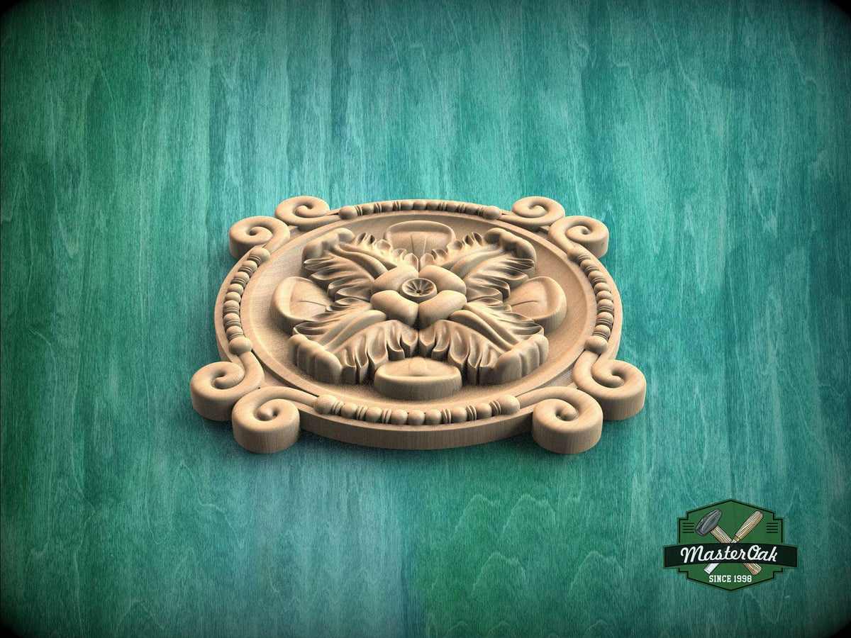 A wooden carving of a flower with leaves, displayed on a green background.