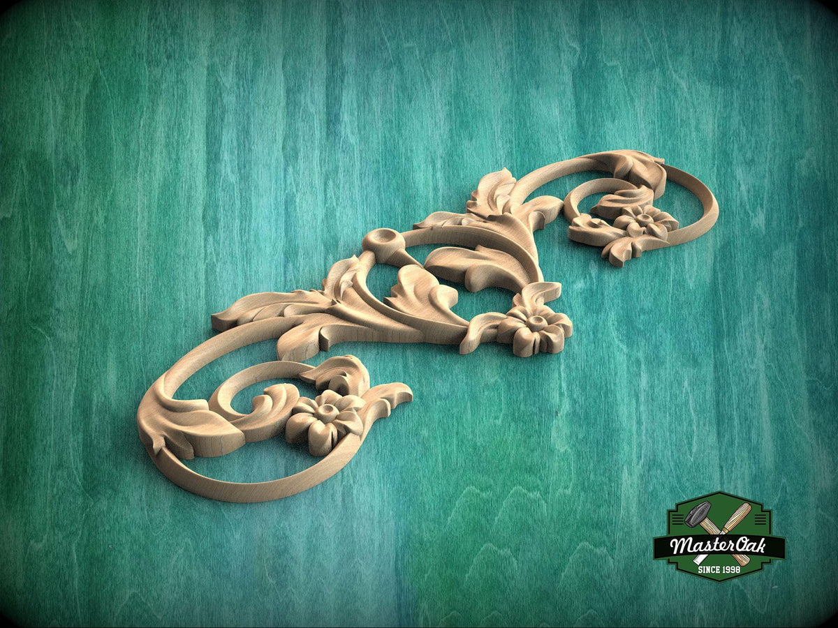 A decorative wooden carving with intricate floral and leaf-like patterns is displayed against a green textured background.