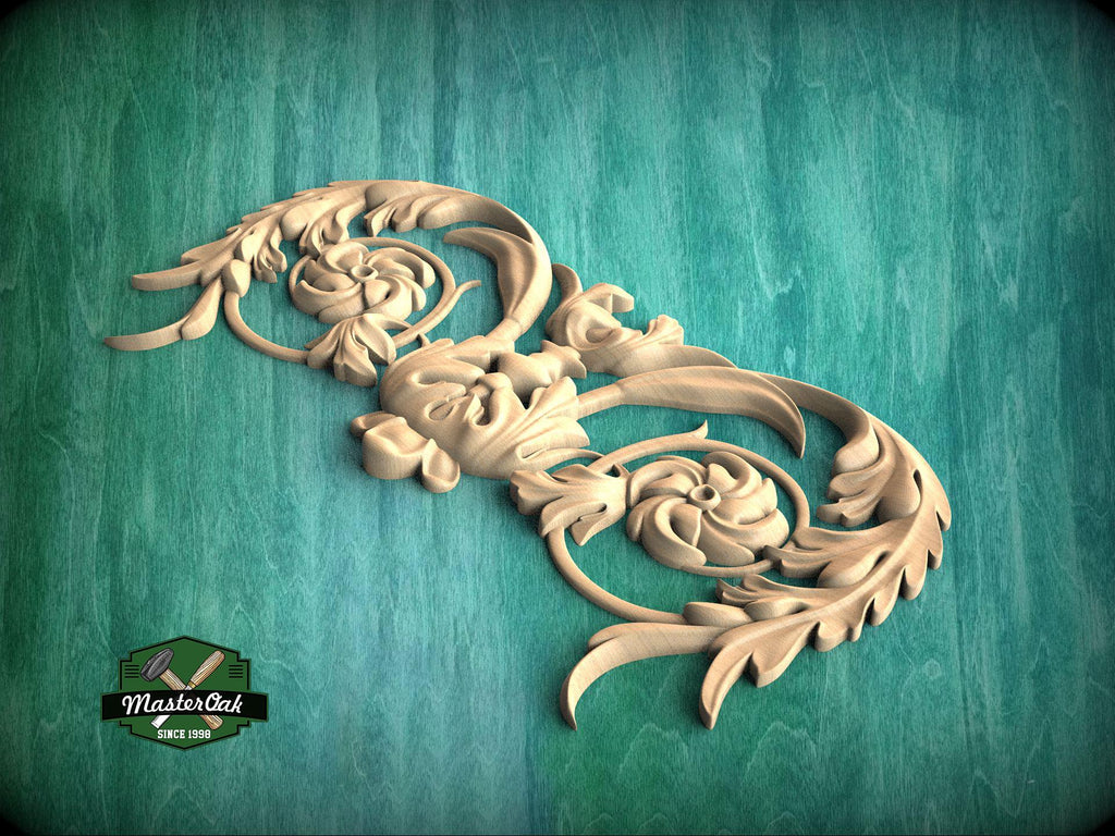 A decorative wooden carving with intricate floral and leaf-like patterns is displayed against a green background.
