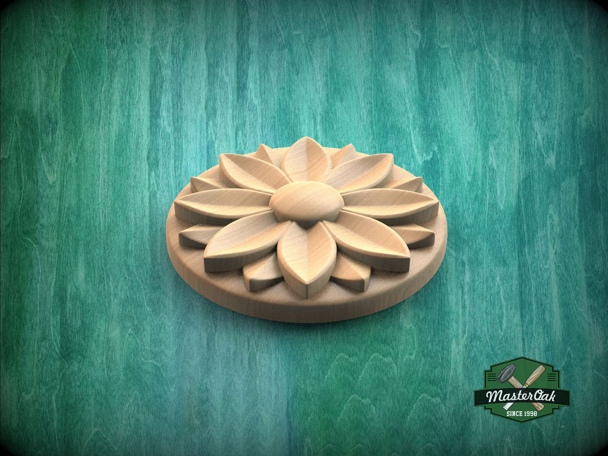A wooden flower-shaped object is displayed against a green background.